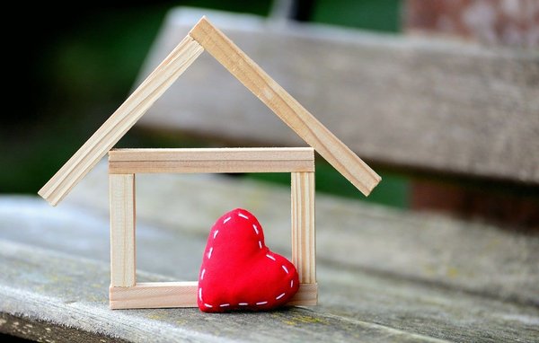 What are the challenges of implementing IoT technologies in older real estate properties for smart upgrades?